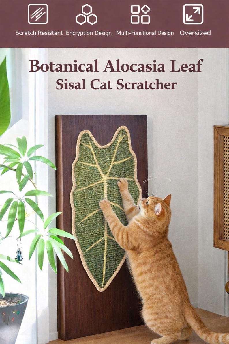 May include: A botanical-themed cat scratcher shaped like an Alocasia leaf. The green sisal mat has a light brown border and a light yellow vein pattern. A ginger cat is shown scratching the leaf-shaped mat, mounted on a dark brown wooden board.