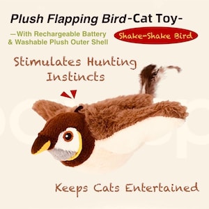 Op de afbeelding: Een bruin en wit pluche vogelvormig kattenspeeltje met een gele snavel en grote ogen. Het speelgoed heeft uitgestrekte vleugels en de tekst "Shake-Shake Bird". De tekst "Stimuleert jachtinstincten" is ook zichtbaar.
