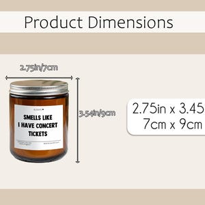 May include: A brown glass candle jar with a silver lid. The label reads "SMELLS LIKE I HAVE CONCERT TICKETS." The candle is 7cm in diameter and 9cm tall.