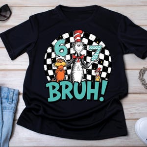 May include: Black t-shirt featuring a cartoon illustration of the Cat in the Hat holding the numbers 6 and 7. The design includes the word "BRUH!" in teal, set against a black and white checkered background. The Cat in the Hat is wearing his signature red and white striped hat.