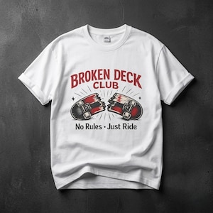 May include: White t-shirt featuring a graphic of a broken skateboard with the text "BROKEN DECK CLUB" in red, and the words "No Rules • Just Ride" below the graphic. The design has a vintage, distressed look.