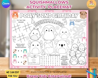 May include: A pink-bordered activity placemat featuring Squishmallows characters. The placemat includes a tic-tac-toe board, a maze, a word search, and matching games. Text on the placemat reads "Polly's 2nd Birthday" and "Keeps Kids Entertained!"