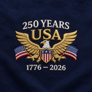May include: Embroidered emblem on navy blue fabric. Features a golden eagle with outstretched wings, the text "250 YEARS USA" above, and "1776-2026" below. Includes American flag elements.