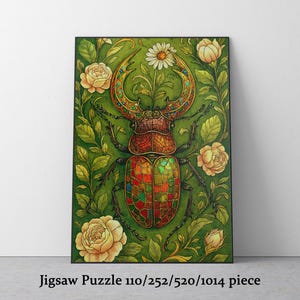 May include: A jigsaw puzzle featuring a detailed illustration of a beetle with ornate, colorful wings and a patterned body. The beetle is set against a green background with roses and foliage. The text "Jigsaw Puzzle 110/252/520/1014 piece" is at the bottom.