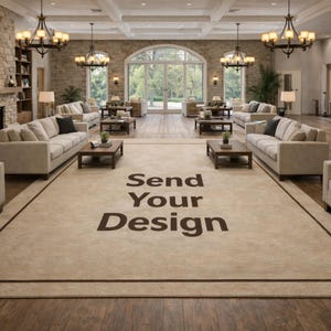 May include: A large beige rug with a dark brown border dominates the centre of a spacious room, furnished with beige sofas and wooden coffee tables. The text "Send Your Design" is printed on the rug. The room features a fireplace, chandeliers, and large windows.