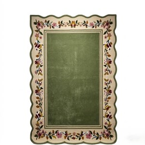 May include: A rectangular rug with a scalloped edge, featuring a solid olive green centre framed by a cream-coloured border. The border is decorated with a continuous floral vine pattern in shades of pink, burgundy, brown, and dark green.