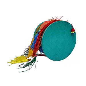 May include: A teal-colored, round percussion instrument with colorful tassels. The instrument has a circular frame with a stretched surface. Tassels in red, yellow, blue, and green hang from the side.