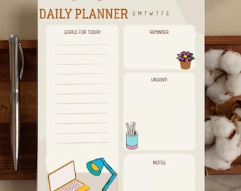 May include: A Daily Planner notepad with a light beige background. The notepad features sections for goals, reminders, and notes, along with illustrations of a laptop, desk lamp, and glasses. The words "DAILY PLANNER" are printed at the top.