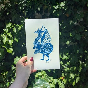 Medieval marginalia linocut print - Face dragon snail