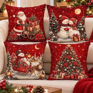 May include: A set of four square throw pillows featuring festive Christmas scenes in shades of red. Designs include Santa Claus with a sleigh of gifts, two snowmen, a snowman riding in a sleigh pulled by a reindeer, and a decorated Christmas tree.