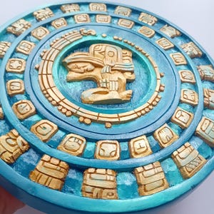 Black Mayan calendar sculpted in cedar