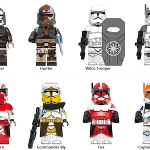 Könnte beinhalten: Sammlung von acht Star Wars-Minifiguren, jede mit einzigartiger Rüstung und Helm. Die Figuren umfassen Wrecker, Hunter, Wilco Trooper, Cody, Thorn, Commander Bly, Fox und Captain Vaughn. Jede Figur ist etwa 5 cm groß.