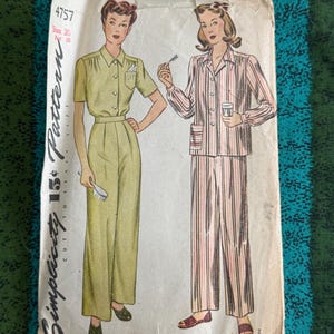 May include: Vintage Simplicity pattern featuring illustrations of women's clothing. One woman is in a green jumpsuit, the other in pink striped pajamas. The pattern is marked "4757" and "15¢". The cover is aged with wear.