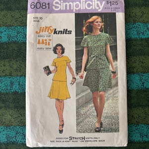 May include: Vintage Simplicity sewing pattern, size 10 Miss. The pattern features illustrations of two dresses, one yellow and one green with white polka dots. The pattern is labeled "Jiffy Knits" and "easy sew".