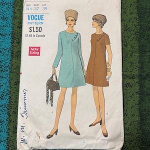 May include: Vintage Vogue pattern 7611 featuring illustrations of two women in 1960s dresses. The pattern includes sizing information and the Vogue logo. The cover is aged with some wear and tear.