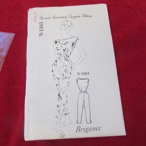 May include: A vintage sewing pattern for a jumpsuit, labelled N-1161, from Spadeas American Designer Pattern. The black and white illustration shows the jumpsuit design, with the word "Brigance" at the bottom of the pattern.