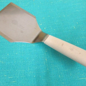 Rubber spatula with a wooden handle available as Framed Prints, Photos,  Wall Art and Photo Gifts