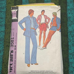 May include: Vintage McCall's 3581 sewing pattern for men's patio jacket, pants, walking shorts, and swim trunks. The pattern envelope features illustrations of the clothing designs in shades of blue, red, and white. The envelope is white with black and purple text.