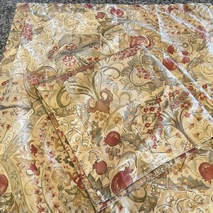 May include: Set of four beige and brown patterned pillowcases with red floral accents. The pillowcases feature a repeating pattern of stylized flowers and leaves.