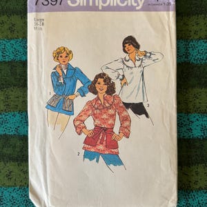 May include: Vintage Simplicity sewing pattern 7397 for Misses' sizes 16-18. The pattern envelope features illustrations of three different blouses and jackets. The envelope is white with purple text and a price tag.