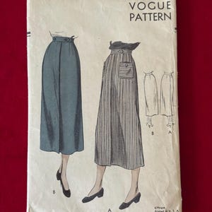 May include: Vintage Vogue sewing pattern for a skirt, pattern number 6665-40c, size 26 waist and 35 hip. The pattern shows three different skirt styles, one with a striped fabric, one with a solid fabric, and one with a plain fabric.