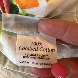 May include: White fabric label with the text "100% Combed Cotton" and the company information "PJ Flower & Co Ltd. Berkhamsted HP4 2AF Made in the United Kingdom."