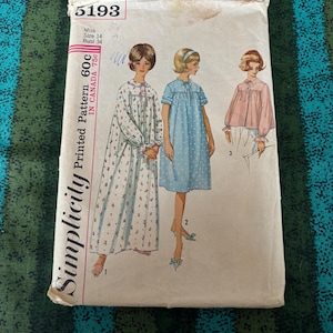 May include: Vintage Simplicity printed pattern envelope featuring illustrations of three nightgown designs. The envelope is white with pink and red text, including the number 5193, size 14, and bust 34. The pattern is for a nightgown, a dotted dress, and a pink top.