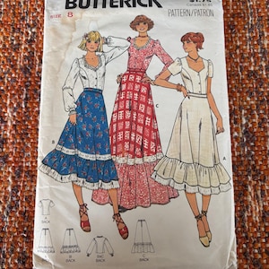 May include: A vintage Butterick sewing pattern, size 8, featuring illustrations of three different dress designs. The pattern cover displays the text "Quick! Butterick" and the number "6085". The dresses include long sleeves, ruffles, and various patterns.