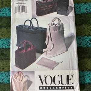 May include: A Vogue Accessories sewing pattern featuring various bag designs. The pattern includes images of tote bags, handbags, and a small pouch. The pattern number is 9020, and the text "ONE SIZE" is visible. The bags are in various colors and styles.