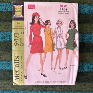 May include: Vintage McCall's sewing pattern for Misses' dresses in six versions. The pattern features illustrations of women in various dress styles. The cover includes text such as "New Easy" and "Quickie".