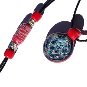 Red Cremation Jewelry Set with ashes-infused pendant and matching bracelet. Made to order by DragonFire Glass