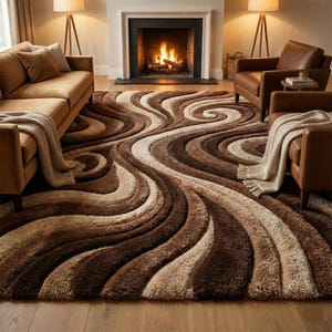 May include: A large, plush area rug with a swirling, abstract design in shades of brown and beige. The rug's texture is visible, with varying pile heights creating depth. The rug is placed in a living room setting, with a sofa, chairs, and a fireplace.