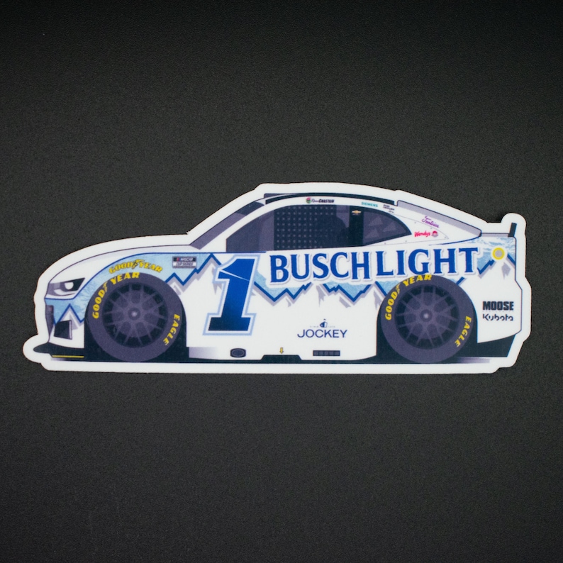 May include: A white sticker featuring a race car design with the Busch Light logo and the number 1 in blue. The car has Goodyear tires and sponsor logos, with a mountain range design.