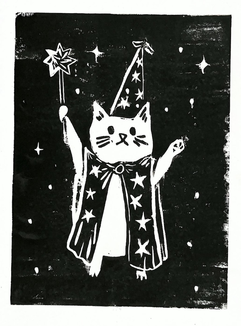 May include: Black and white illustration of a cat dressed as a wizard, holding a star-tipped wand. The cat wears a wizard hat and a cape adorned with stars, set against a starry background. A whimsical design.
