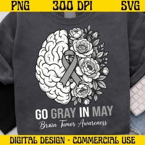 Puede incluir: Sudadera gris oscuro con un diseño de cerebro, cinta gris y arreglo floral. El texto "GO GRAY IN MAY Brain Tumor Awareness" se muestra debajo. El diseño es para uso digital.