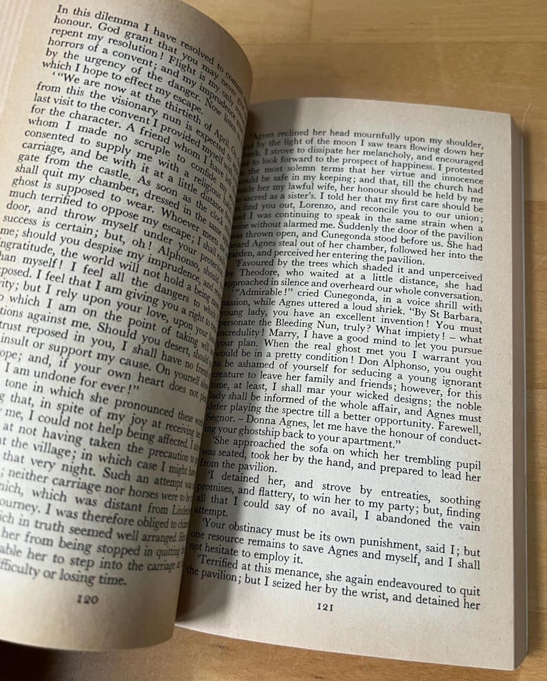 May include: Open book with text on aged paper. The pages are slightly yellowed, and the text is in a classic serif font. The book is open, revealing two facing pages filled with paragraphs. The image captures the essence of reading and literature.