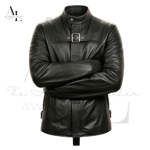 May include: Black leather jacket with a stand-up collar and a buckle closure across the chest. The jacket has a tailored fit and features a unique design with horizontal and vertical straps. The sleeves are long, and the jacket appears to be made of high-quality leather.