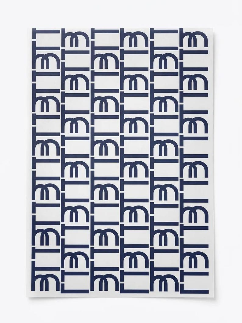 May include: A rectangular print featuring a repeating pattern of dark blue geometric shapes on a white background. The design consists of vertical columns of stylized, interconnected letter-like forms arranged in a structured, grid-like layout.