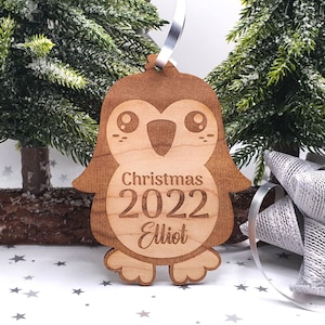 Custom penguin Christmas 2025 tree bauble, wooden tree ornaments, personalised with name, Gift for child with penguins, animal lover gift