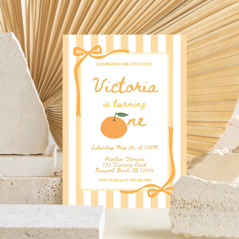 May include: An invitation with a light orange and white striped background. The text reads "Celebrating One Little Cutie" and "Victoria is turning one." An orange graphic is featured. The invitation includes event details and an RSVP.