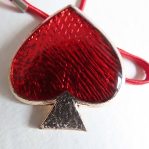 Broche ou pendentif YSL Yves Saint Laurent pique rouge