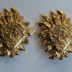 Yves Saint Laurent sun earrings designed by Robert Gossens