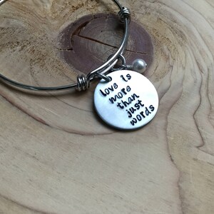 Inspirational Bangle Bracelet: Love Quote, Accent Bead, Adjustable