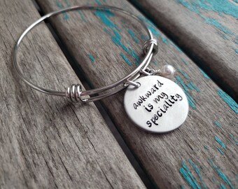 Awkward is My Speciality Bangle Bracelet: Stainless Steel, Accent Bead
