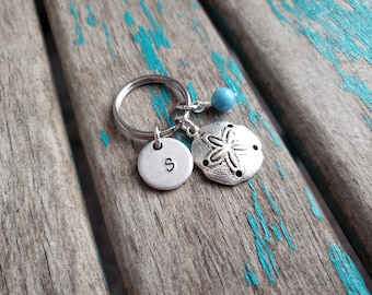 Porte-clés dollar des sables avec initiales et perles décoratives au choix