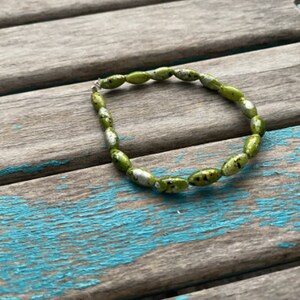 Green with Gold, Black, and Silver Flecks Beaded Bracelet
