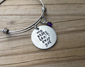 My Story Quote Bracelet- Hand-stamped "my story isn't over yet" with an accent bead in your choice of colors