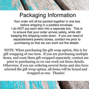 May include: Text on a blue and white wooden background explaining packaging information for orders. The text states that orders are packed together in one box and shipped in a padded envelope. It also explains that the seller does not put each item in a separate box to ensure the order arrives safely and to keep shipping costs down. The text also explains that if you need separate jewelry boxes, you should contact the seller prior to purchasing. The text also explains that the gift wrap option is for one item only and that if you are purchasing multiple items and want them gift wrapped separately, you should contact the seller prior to purchasing. The text also explains that if you are ordering several items and have selected the gift wrap option, all items will be boxed and wrapped as one. The text ends with "Thanks!"