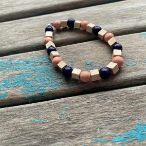Pink, Deep Blue, and Cream/Tan Wood Beaded Bracelet