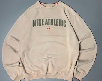 Sudadera Nike Vintage 90s morada con estampado tie-dye, cuello redondo, logo grande en el centro, talla L